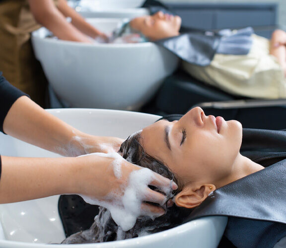 Woman getting her hair washed at a hair salon. 